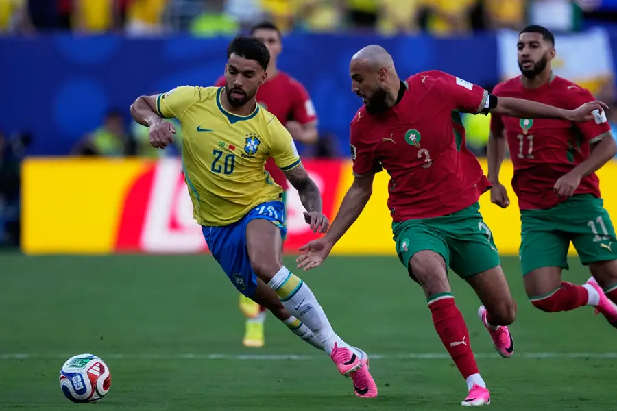 Brazil vs Morocco FIFA World Cup 2026 match ending in a 1-1 draw with Vinicius Junior celebrating his goal.